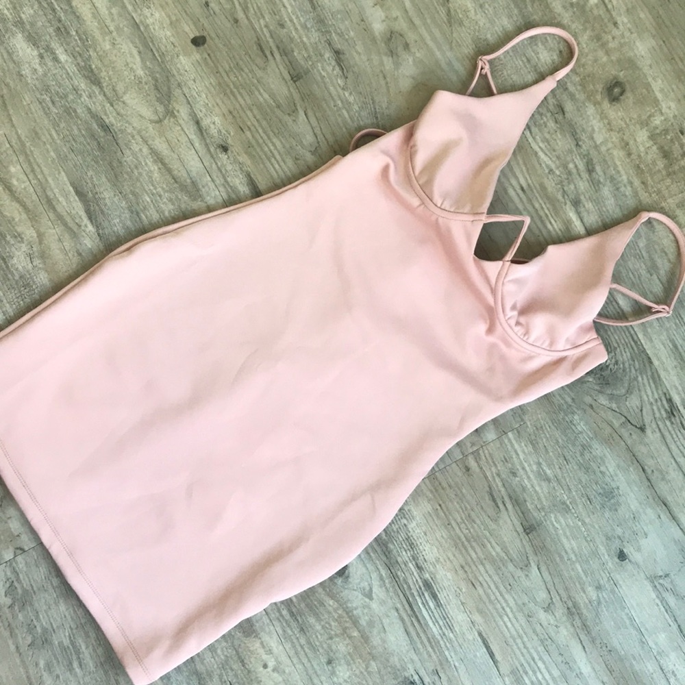 The boutique backless push up breast dress